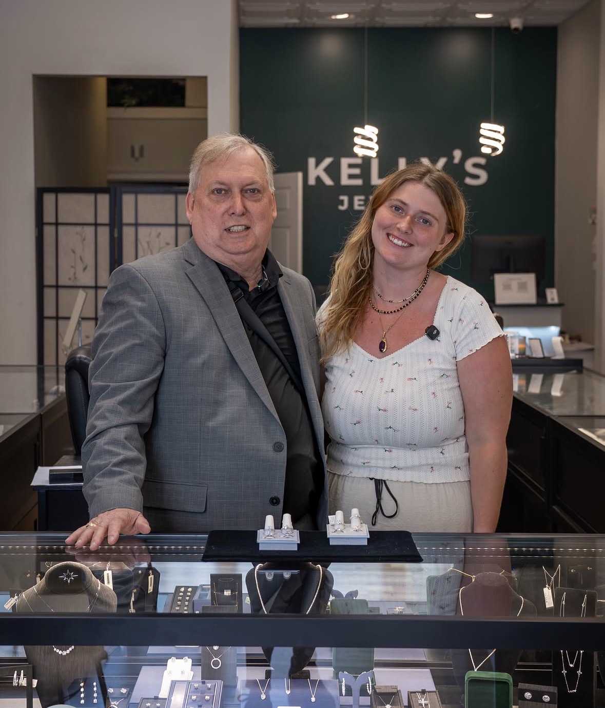 Rachel Kelly and Tom Kelly behind the jewelry counter at Kelly's Jewelry